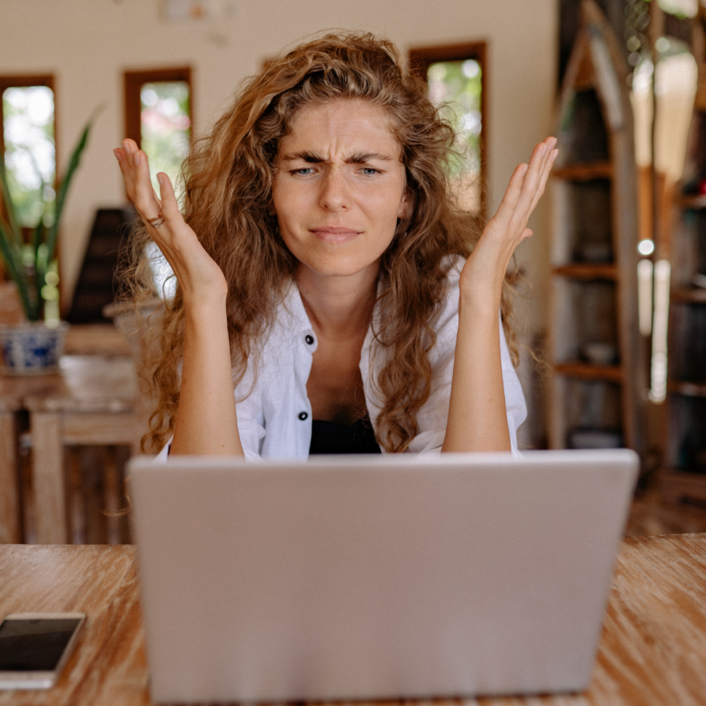 Frustrated woman staring at computer